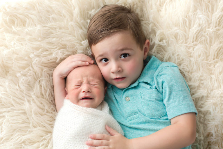 Brothers newborn poses